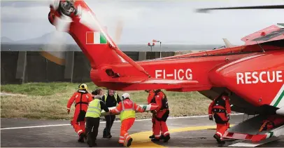  ?? Photo: Steve Humphreys ?? Debris from the missing Rescue 116 helicopter is brought back to Blacksod pier from another Coast Guard Helicopter.