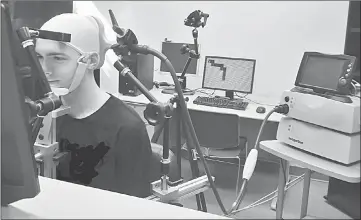  ??  ?? Test subjects navigated simple mazes based solely on inputs delivered to their brains by a magnetic coil placed at the back of the skull. — University of Washington photo