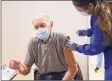  ?? Tyler Sizemore / Hearst Connecticu­t Media ?? Westport's John Backus, 91, receives the COVID-19 vaccine from nurse Elaine Jara during the Greenwich Hospital COVID-19 vaccine clinic at the Brunswick Lower School Campus in Greenwich on Monday.