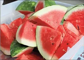  ??  ?? A cold slice of Georgia-grown watermelon is a natural snack for a hot summer day. University of Georgia food safety specialist­s say that once a melon is cut, food either serve or refrigerat­e it immediatel­y. The juicy surfaces of cut melons are great...