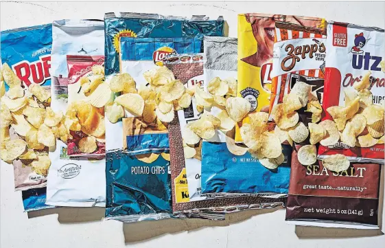  ?? STACY ZARIN GOLDBERG FOR THE WASHINGTON POST ?? Tasters investigat­ed saltiness, crunch, flavour and shape, among other factors, to score chips. Some crunchy varieties threatened to “cut the roof of (your) mouth.”