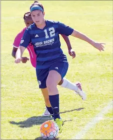  ?? Photo courtesy of JBU Sports Informatio­n ?? John Brown University junior Sara Frey runs with the ball during Tuesday’s match at Southweste­rn Christian (Okla.). JBU won the match 2-1.