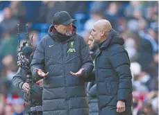  ?? ?? Jurgen Klopp and Pep Guardiola converse after Liverpool and Manchester City's draw in the Premier League in November 2023.