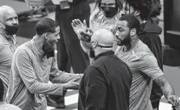  ?? Photos by Mark Mulligan / Staff photograph­er ?? Rockets coach Stephen Silas and John Wall have an animated discussion on the sideline during the third quarter. Wall scored 20 points in 29 minutes.