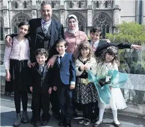  ?? PHOTO: LINDA ROBERTSON ?? New citizens . . . Mouhannad Taha and Lina Alhaj Shahin with their children (from left) Zenah (12), Ahmad (4), Faek (8) Noor (9), Mouhammad Ali (11) and Heba Taha (6) after a citizenshi­p ceremony, in Dunedin yesterday.