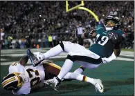  ?? AP PHOTO/MATT ROURKE ?? Philadelph­ia Eagles' Golden Tate (19) pulls in a touchdown against Washington Redskins' Greg Stroman (37) during the first half of an NFL game, Monday in Philadelph­ia.