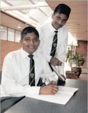  ??  ?? Wingen Heights pupils Deereshan Naidoo, seated, and Josiah Gengan share a passion for maths.
