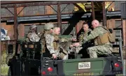  ?? AP/The Roanoke Times/HEATHER ROUSSEAU ?? Roanoke Sheriff’s Office SWAT team members respond to a shooting at FreightCar America in Roanoke, Va., on Tuesday morning.