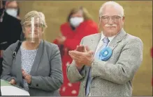  ?? Pictures: Stuart Martin ?? THE VOTES ARE IN Elizabeth Lloyd for Stakes, above left, and Peter Wade, representa­tive for Waterloo at the Havant elections, while above right the count at the leisure centre