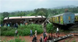  ?? — ASIAN AGE ?? The coaches of Nagpur-Mumbai Duronto Express which derailed near Asangaon in Maharashtr­a's Thane district on Tuesday morning.