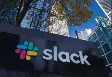  ?? KARL MONDON — STAFF ?? The Salesforce Tower rises up in the background of Slack headquarte­rs in San Francisco. Salesforce announced its acquisitio­n of the business chat service on Tuesday in a deal that is the largest in Salesforce’s 21-year history.