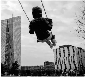  ?? AP ?? A girl plays on a swing near the European Central Bank in Frankfurt, Germany, on Wednesday, March 6, 2024.