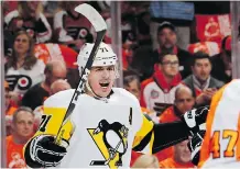  ?? ELSA/GETTY IMAGES ?? Evgeni Malkin scored the first of five Pittsburgh goals as the Penguins downed the Flyers 5-0 in Philadelph­ia Wednesday.