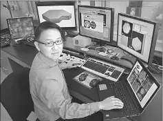  ??  ?? Dong Su in the control room of the aberration-corrected scanning transmissi­on electron microscope. — Brookhaven National Laboratory photo