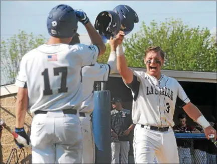  ?? GENE WALSH — DIGITAL FIRST MEDIA ?? La Salle’s Andrew Cossetti celebrates his run with teammates during the Explorers’ game against Cardinal O’Hara Wednesday.