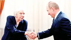  ??  ?? File photo show Putin shakes hands with Alexeyeva before his meeting with Russian human rights activists outside Moscow on Jan 23, 2014. — Reuters photo