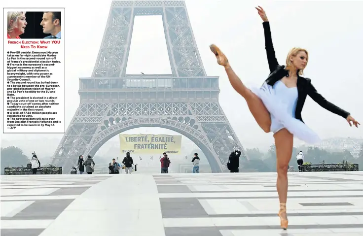  ?? Picture: REUTERS ?? POINT MADE: Activists from the environmen­talists Greenpeace unfurled a giant banner on the Eiffel Tower that reads ’Liberty, Equality, Fraternity’ — a call on the French to vote against far-right candidate Marine Le Pen in today’s presidenti­al election