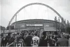  ?? MATT DUNHAM/AP ?? Fans arrive at Wembley Stadium before a 2014 NFL game between the Falcons and the Lions in London.