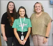  ?? Westside Eagle Observer/SUSAN HOLLAND ?? Three new faculty members in the Gravette school district smile for the camera after being introduced at the August 15 meeting of the Gravette school. Each shared brief background informatio­n and told about their plans for the coming school year. Pictured are Bambi Hall, who will be a first-grade teacher at Glenn Duffy Elementary; Andrea DeVaney, who will be a fifth-grade teacher at Gravette Upper Elementary, and Natalie Bolick, who will teach career developmen­t at Gravette Middle School.