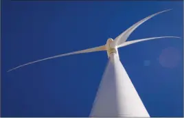  ?? Canadian Press photo ?? A wind turbine is shown at a wind farm near Pincher Creek last year. Involving community members in wind-farm planning and ensuring nearby residents benefit from turbines would go a long way toward winning local buy-in for such projects, a new Canadian study concludes.