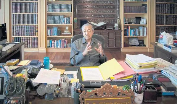  ??  ?? AT HOME: Former Malaysian strongman Mahathir Mohamad speaks during an interview at his office in Putrajaya. Mr Mahathir is leading an opposition coalition to oust scandalise­d Prime Minister Najib Razak in May 9 polls.