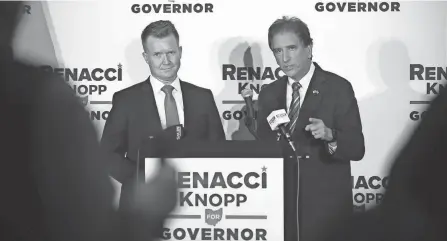  ?? AMANDA ROSSMANN/CINCINNATI ENQUIRER ?? Christian film producer Joe Knopp, left, is announced as former Rep. Jim Renacci’s running mate as the Republican seeks to unseat Gov. Mike Dewine.