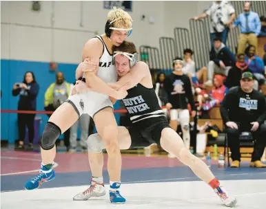  ?? PAUL W. GILLESPIE/CAPITAL GAZETTE PHOTOS ?? South River’s Sam Ditmars, right, tries to take down Annapolis’ Nik Antonelli in the 145-pound championsh­ip match at the Class 4A/3A East Region Tournament on Saturday.