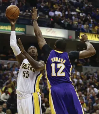  ?? BRENT SMITH/REUTERS ?? Indiana Pacers centre Roy Hibbert, left, takes a shot over defender Dwight Howard of the Los Angeles Lakers.