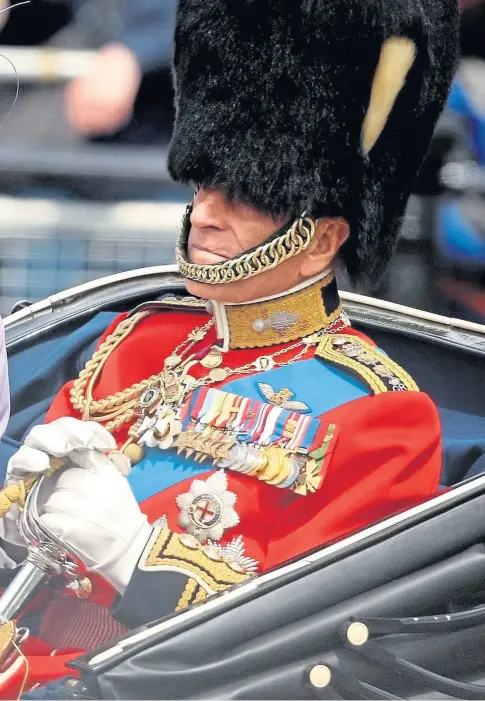  ??  ?? MOURNING: The Queen and Duke of Edinburgh return to Buckingham Palace by carriage following the Trooping the Colour ceremony at Horse Guards Parade in June 2010. The Queen has been supported by her children since the duke died on Friday.