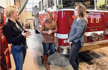  ?? Ned Gerard / Hearst Connecticu­t Media ?? From left, career firefighte­rs Wanda Hittinger and Jamilynn Zapata and Fairfield firefighte­r Caitlin Clarkson Pereira during a visit to the Fairfield Regional Fire School in Fairfield Thursday.