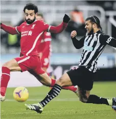  ??  ?? Liverpool’s Mohamed Salah and Newcastle United’s DeAndre Yedlin.