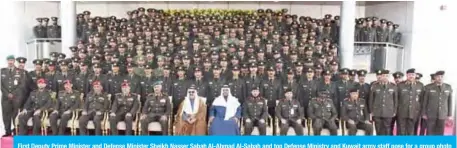  ??  ?? First Deputy Prime Minister and Defense Minister Sheikh Nasser Sabah Al-Ahmad Al-Sabah and top Defense Ministry and Kuwait army staff pose for a group photo with the new graduates.