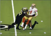  ?? TYLER KAUFMAN — THE ASSOCIATED PRESS FILE ?? San Francisco 49ers quarterbac­k Nick Mullens (4) is hit by New Orleans Saints defensive tackles Malcolm Roach (97) and Shy Tuttle (99) on Nov. 15 in New Orleans.