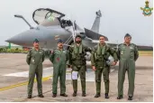  ?? — PTI ?? IAF Chief Air Chief Marshal R.K.S. Bhadauria (2nd left) along with the IAF pilots of the first five Rafale combat aircraft after arriving from France at the Air Force Station in Ambala on Wednesday.