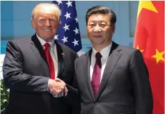  ?? (Saul Loeb/Reuters) ?? MORE CORDIAL TIMES. US President Donald Trump and Chinese President Xi Jinping pose before at the G20 meeting in Hamburg, Germany, on July 8.