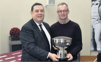  ??  ?? Just Champion Gary Hogg picks up his trophy from council leader Douglas Reid