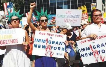  ?? Reuters ?? Demonstrat­ors participat­e in the ‘Keep Families Together’ march to protest the Trump administra­tion’s immigratio­n policy in New York yesterday.