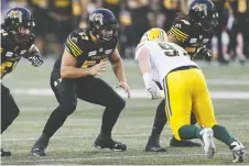  ?? JOHN E. SOKOLOWSKI/TIGER-CATS ?? Essex native Brandon Revenberg, centre, a two-time Eastern Conference all-star, will be at left guard for the Tiger-cats when the Grey Cup kicks off on Sunday in Calgary.