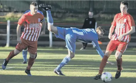  ??  ?? Whitley Bay’s Noah Summers goes flying in Saturday’s Division One clash with Seaham Red Star. Pictures by Tim Richardson.