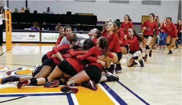  ?? Jason Fochtman photos ?? The Woodlands players rush the court after defeating College Park 3-1 during a Region II-6A final volleyball match at Johnson Coliseum, Saturday in Huntsville.