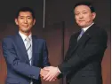  ?? EPA ?? Toshiba Memory president Yasuo Naruke, right, and Bain Capital Japan managing director Yuji Sugimoto