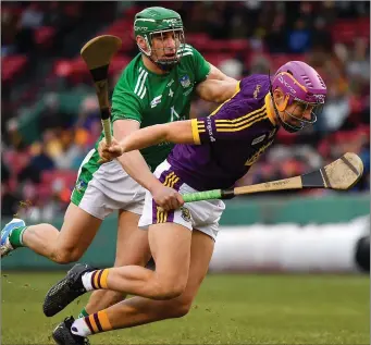  ??  ?? Jack O’Connor tries to escape the close attention of Limerick’s Seán Finn in Boston on Sunday.