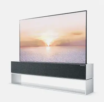  ??  ?? GARAGE DOOR STYLE: LG’s Signature OLED R set has a screen that retracts into its base.