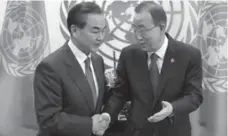  ?? RICHARD DREW/THE ASSOCIATED PRESS ?? China’s Foreign Minister Wang Yi, left, talks with UN Secretary-General Ban Ki-moon before Friday’s Security Council meeting.