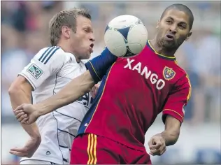  ?? DARRYL DYCK/ CP ?? Whitecaps captain Jay DeMerit ( left) could be cleared to play as soon as Saturday in Portland.