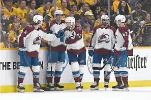  ?? AP Photo/mark Zaleski ?? Colorado Avalanche left wing Gabriel Landeskog (92) is congratula­ted Saturday after scoring his third goal of the game during the second period in Game 3 of an NHL hockey Stanley Cup firstround playoff series against the Nashville Predators in Nashville, Tenn.