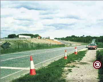  ??  ?? 1996 - The new re-aligned and elevated section of the A20 beside Yonsea Farm (right) to accommodat­e the rail link