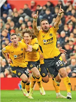  ?? ?? Joao Moutinho (in foreground) of Wolverhamp­ton Wanderers celebrates after scoring against Manchester United during their English Premier League match at Old Trafford stadium in Manchester, England, on Monday.