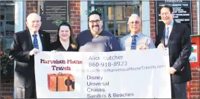  ?? Contribute­d photo ?? Marvelous Mouse Travels at Middlesex County Chamber of Commerce on Dec. 7. From left, Middlesex County Chamber of Commerce President Larry McHugh, Marvelous Mouse Travels agents Alice and Eric Kutchner, Middletown Common Councilor Phil Pessina and Middletown Common Council Majority Leader Tom Serra.