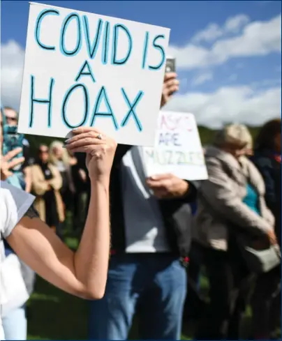  ?? Photograph: Jeff J Mitchell/Getty ?? Anti-lockdown protesters outside the Scottish Parliament in Edinburgh last year